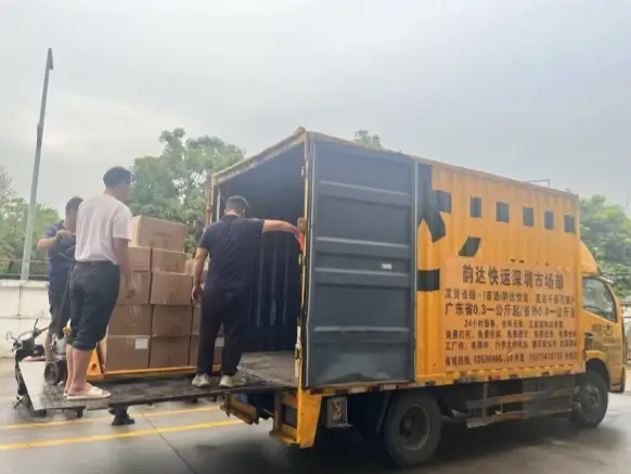 Goods are being loaded onto trucks