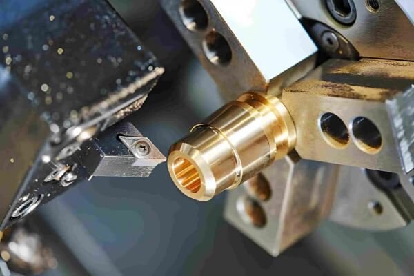 CNC lathe turning a precision metal part